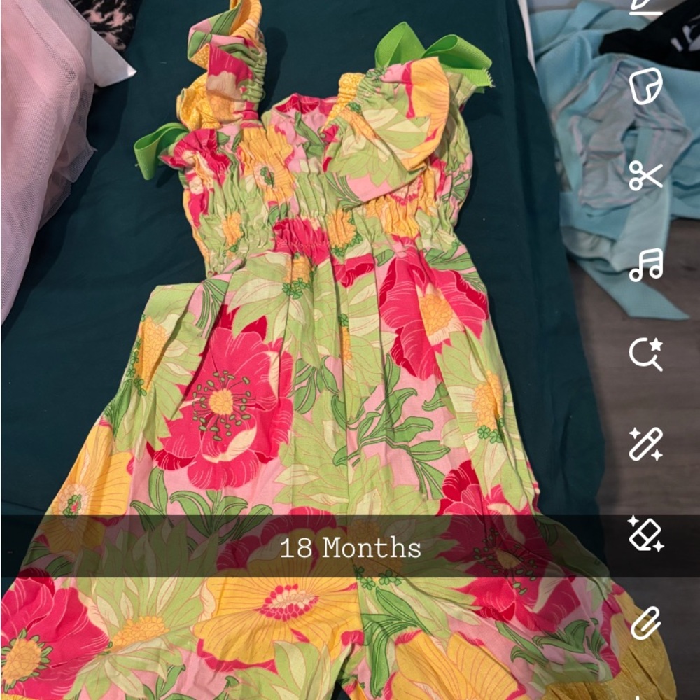 Jumpsuit from an Etsy shop, we used it for a themed pageant, worn once